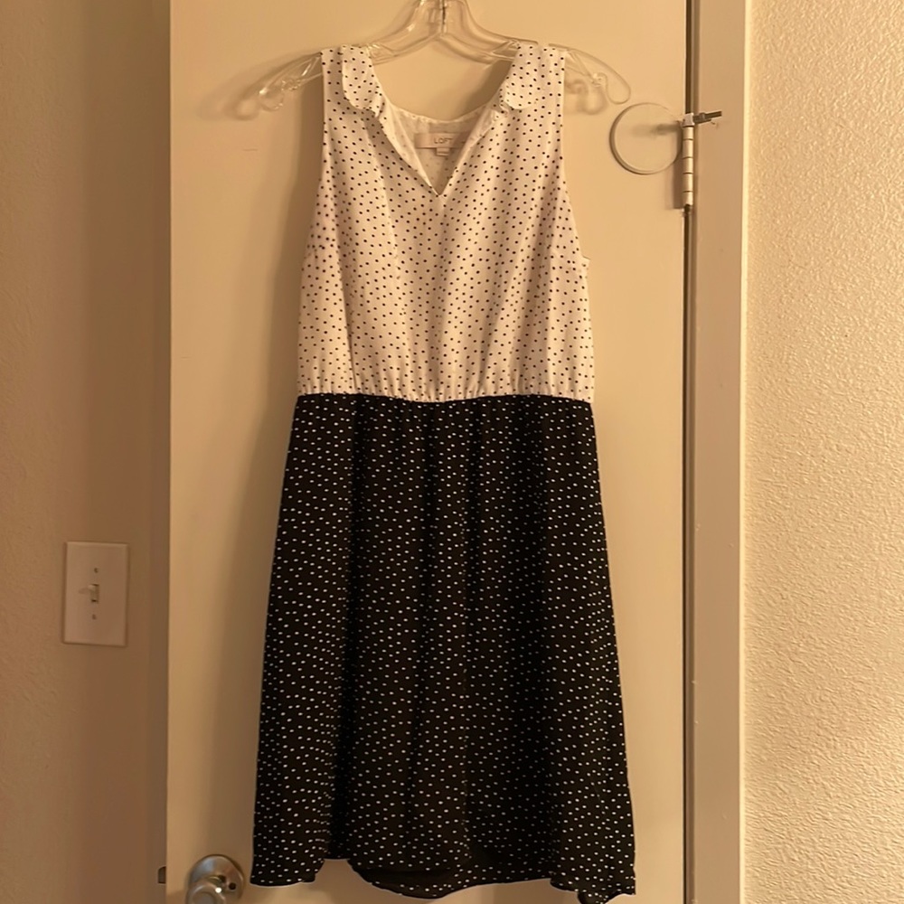 Sleeveless black and white polka dot dress